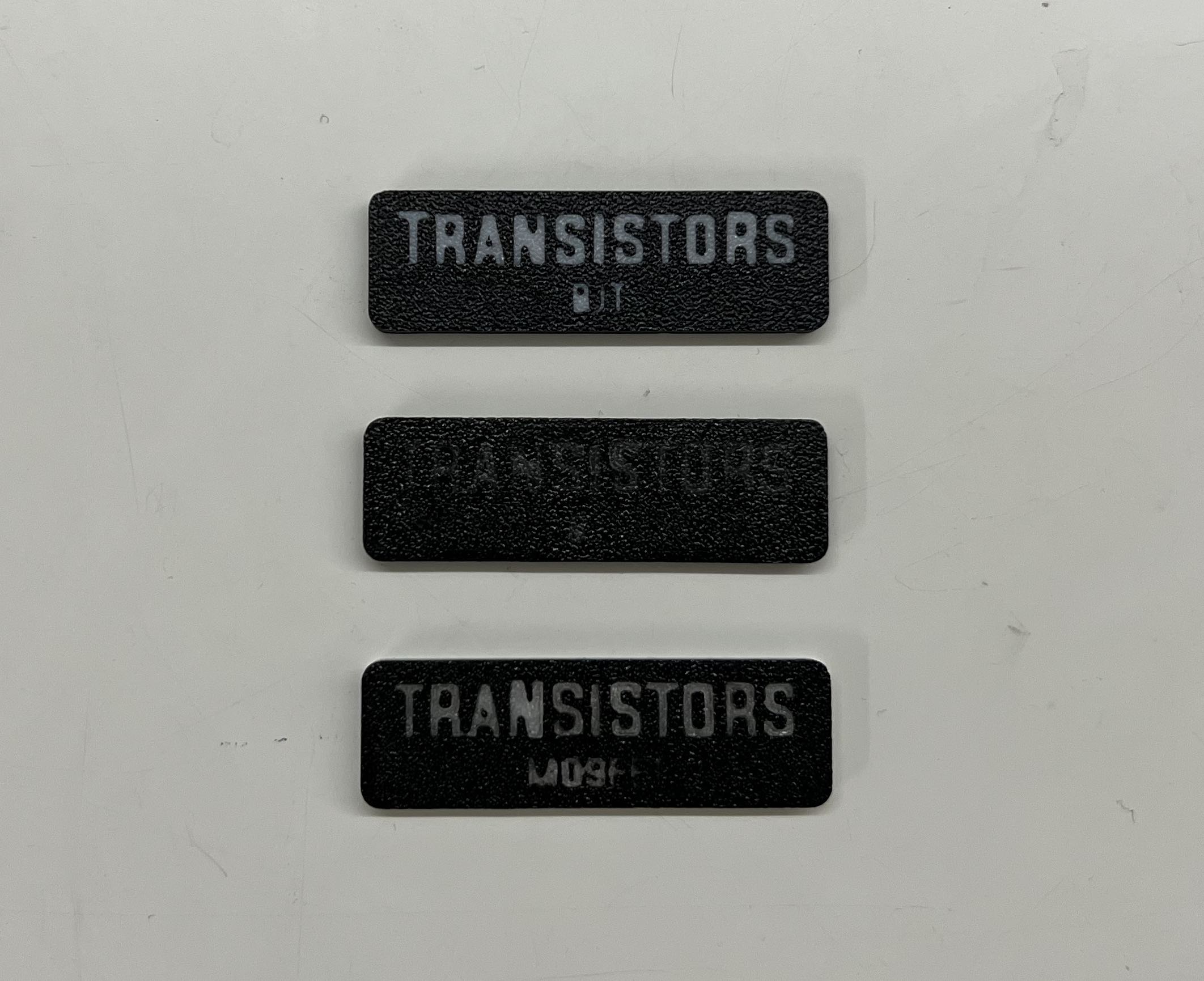 (Top) Black & White; (Middle) Black & Glow-in-the-Dark; (Bottom) Black, Glow-in-the-Dark with White Backing Layers